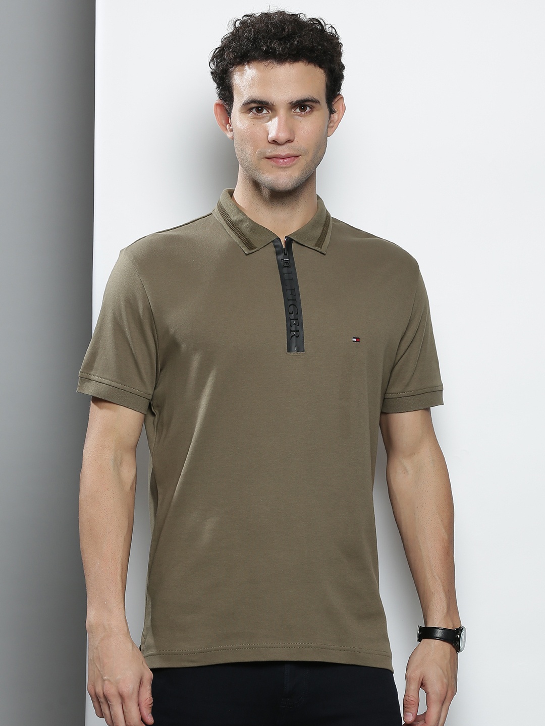 

Tommy Hilfiger Men Olive Green Solid Cotton Polo Collar T-shirt