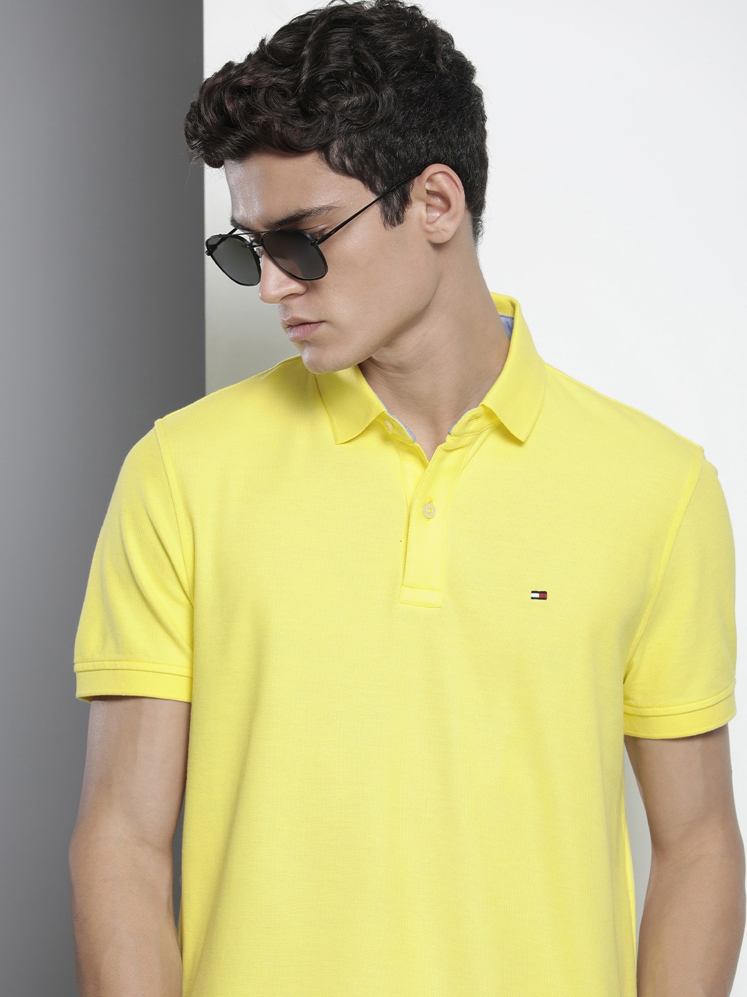 

Tommy Hilfiger Men Yellow Solid Polo Collar Casual T-shirt