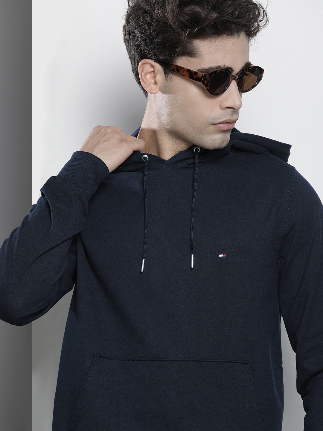 

Tommy Hilfiger Men Navy Blue Solid Hooded Sweatshirt