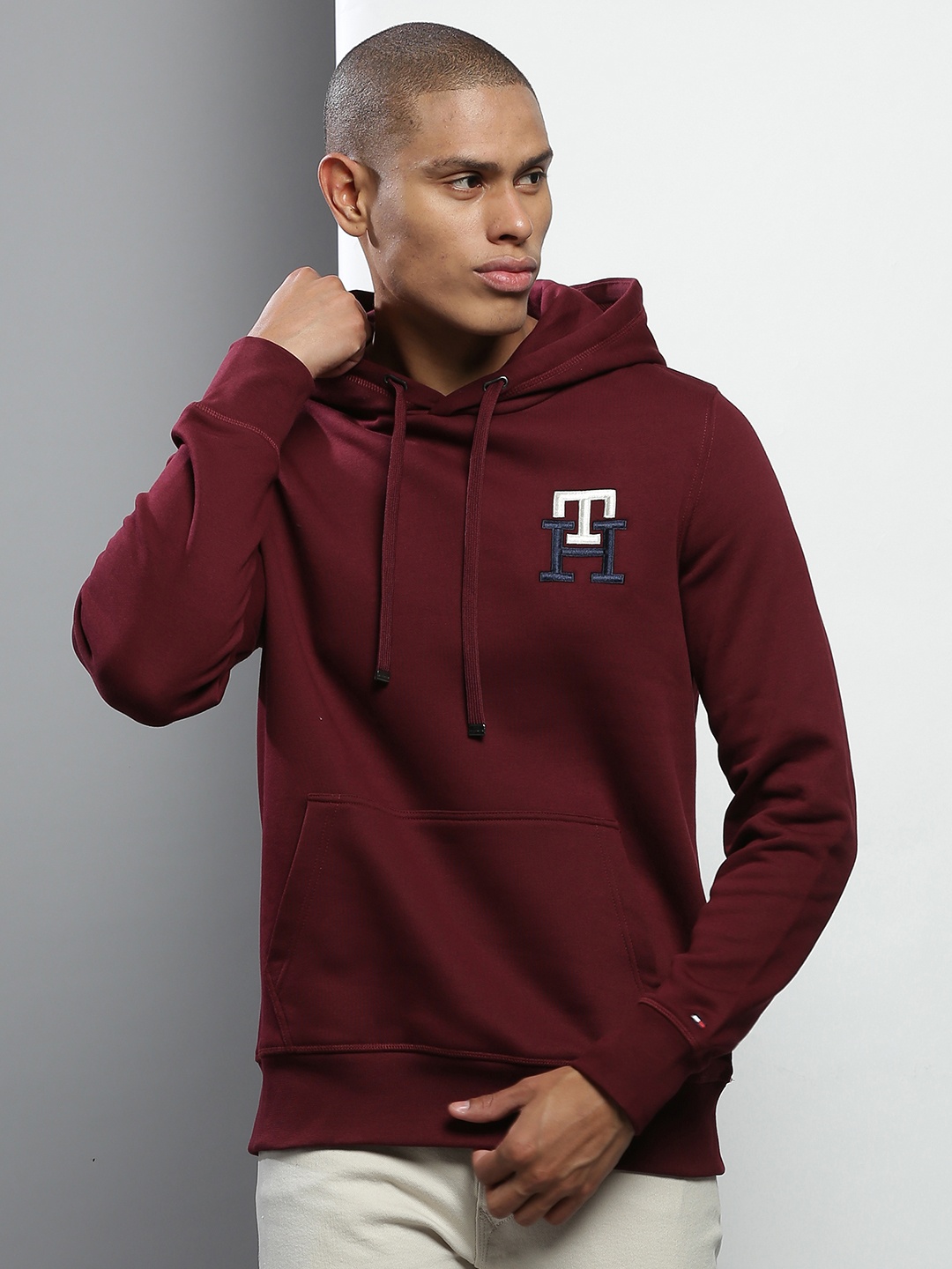 

Tommy Hilfiger Men Maroon Embroidered Hooded Solid Sweatshirt