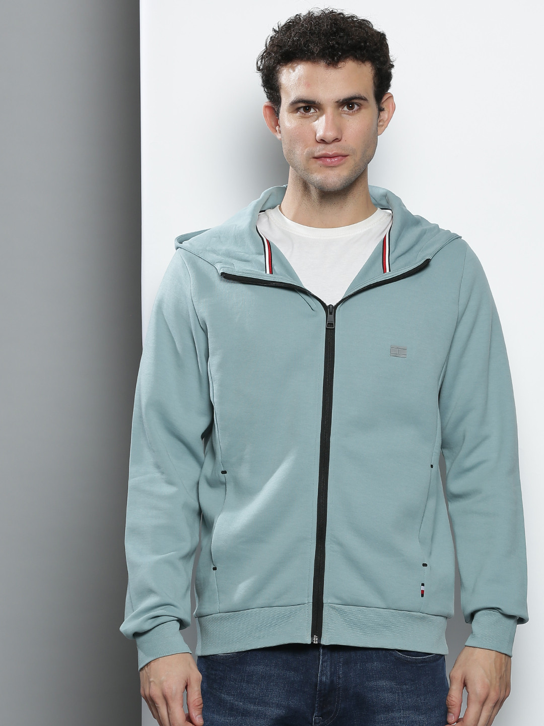 

Tommy Hilfiger Men Blue Solid Hooded Sweatshirt