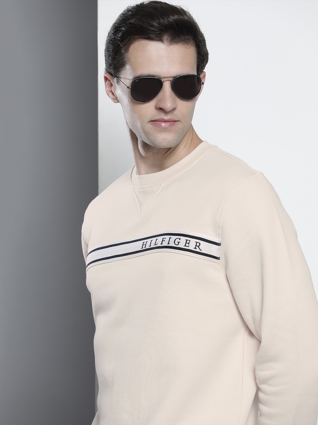 

Tommy Hilfiger Men Beige Solid Sweatshirt