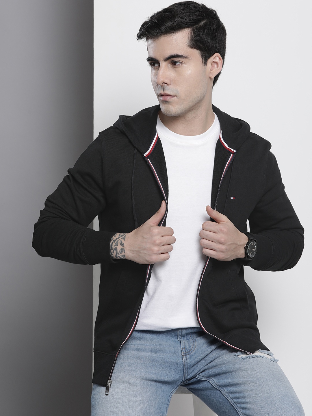 

Tommy Hilfiger Men Black Solid Pure Cotton Hooded Sweatshirt