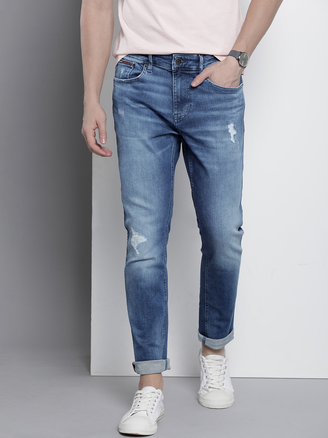 

Tommy Hilfiger Men Slim Fit Mildly Distressed Light Fade Stretchable Jeans, Blue