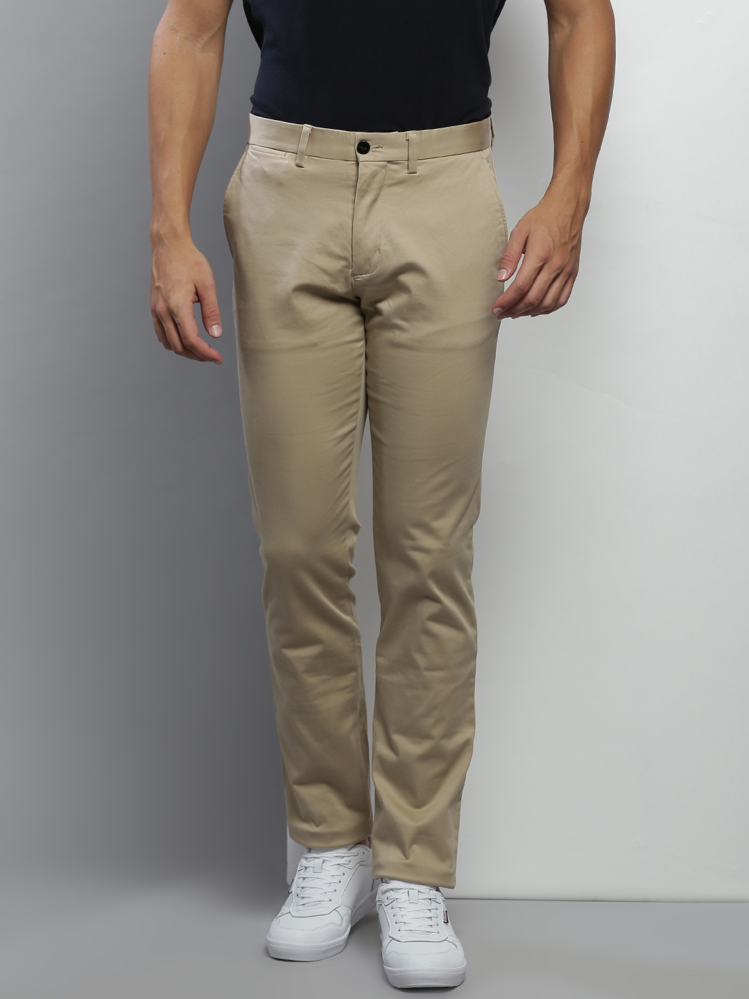 

Tommy Hilfiger Men Beige Solid Cotton Trousers
