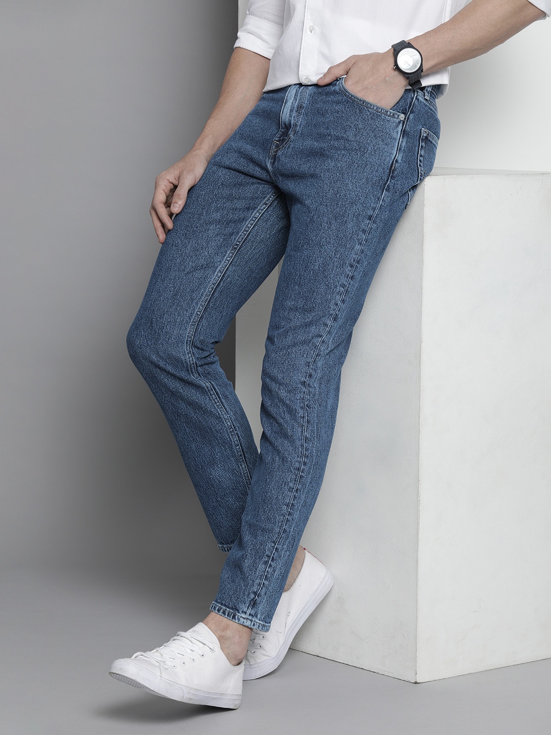 

Tommy Hilfiger Men Blue Tapered Fit Stretchable Jeans