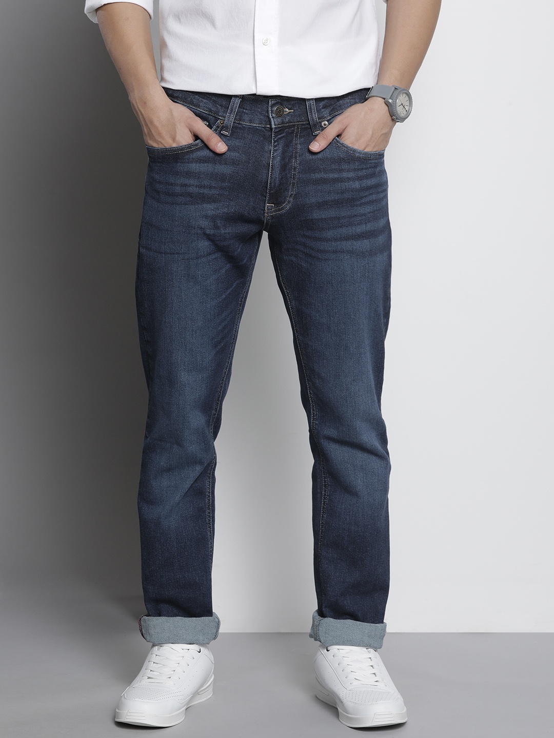 

Tommy Hilfiger Men Blue Slim Fit Mid-Rise Stretchable Jeans