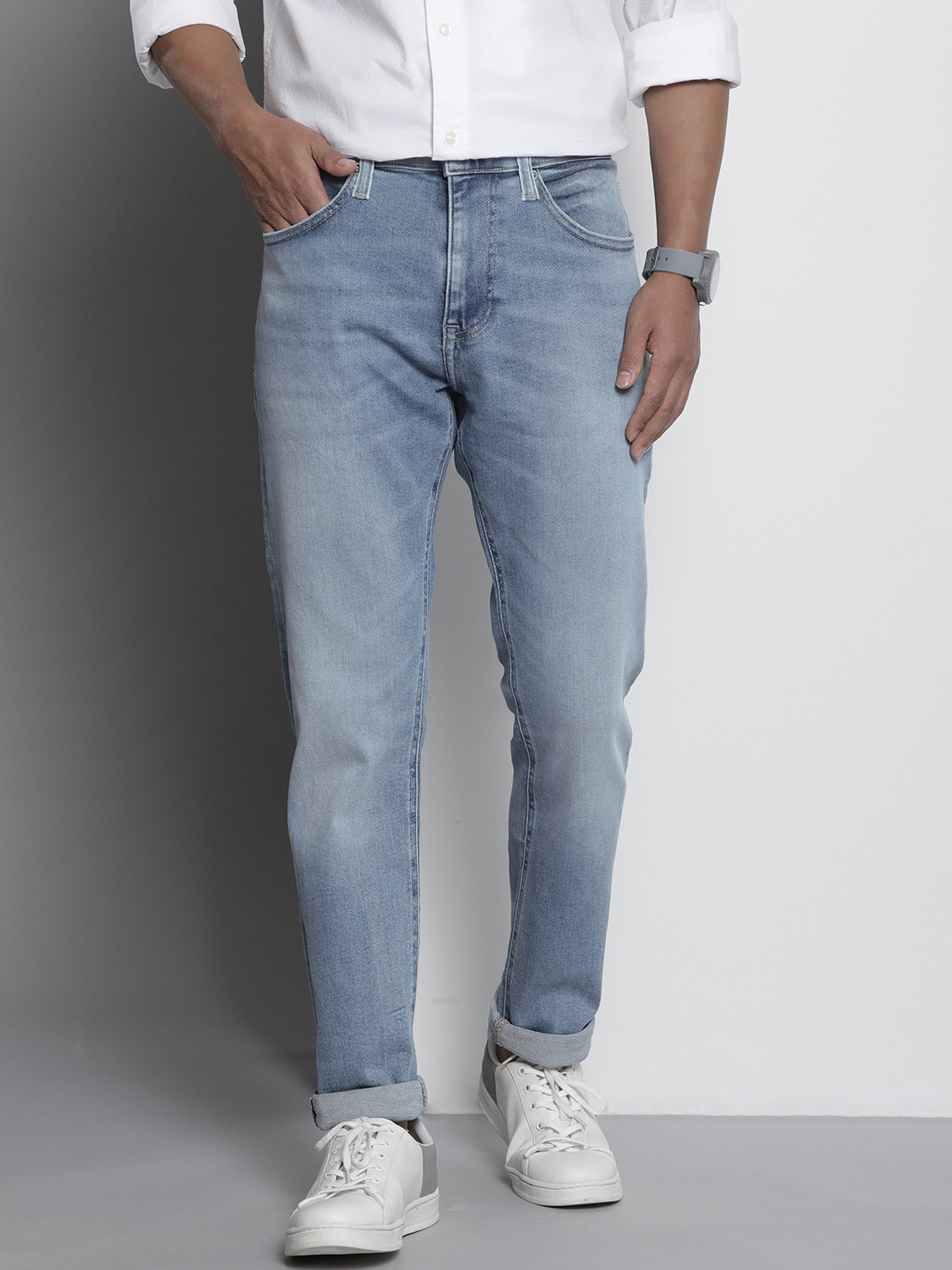 

Tommy Hilfiger Men Blue Slim Fit Mid-Rise Light Fade Stretchable Jeans