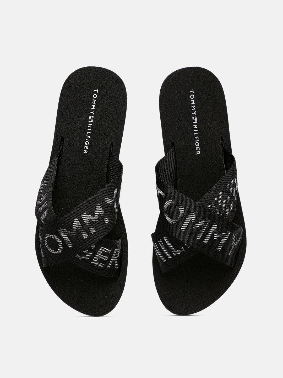 

Tommy Hilfiger Women Black Brand Logo Design Slip-On Flip-Flops