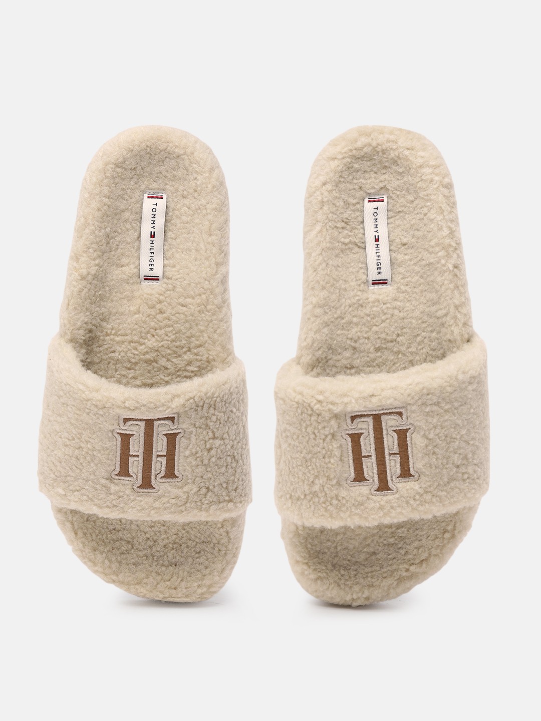 

Tommy Hilfiger Women Beige Solid Sliders