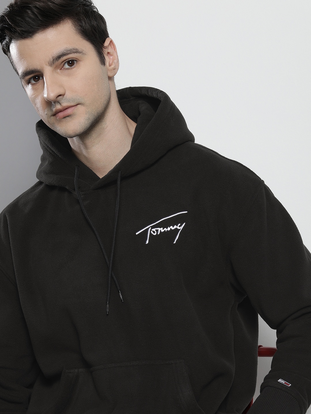 

Tommy Hilfiger Men Black Solid Hooded Sweatshirt with Brand Logo Embroidered Detail