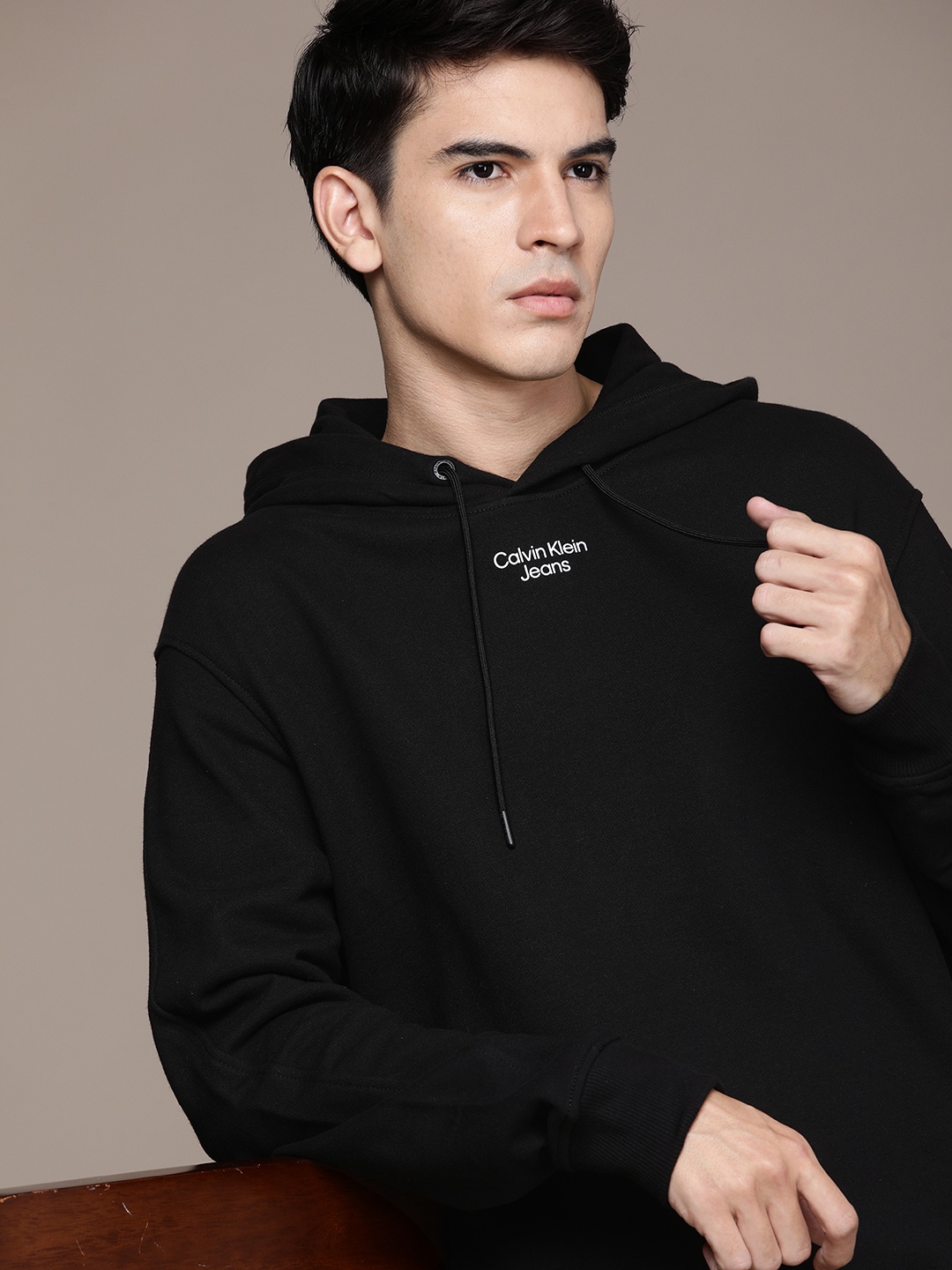 

Calvin Klein Jeans Men Black Brand Logo Printed Applique Hooded Sweatshirt