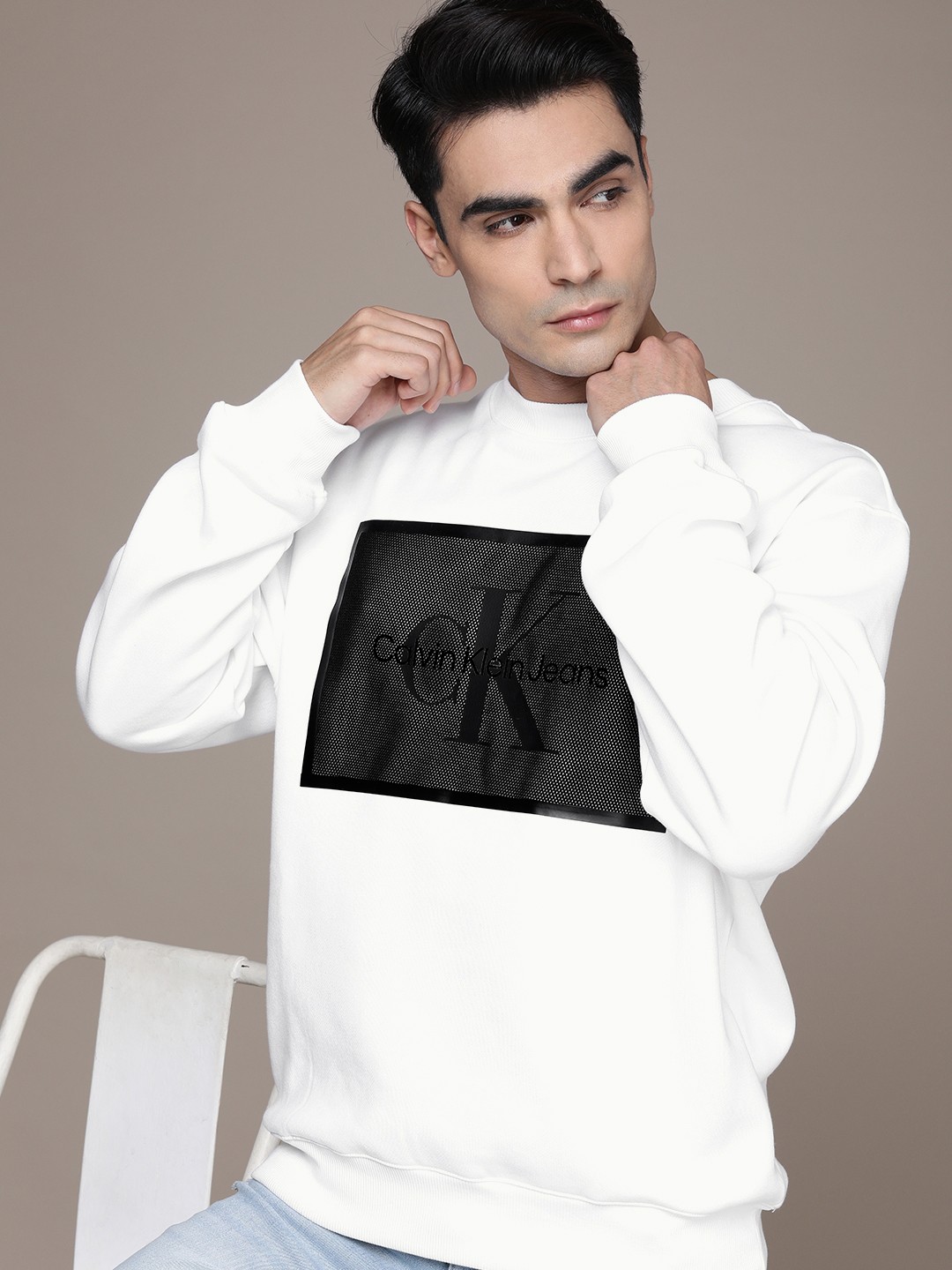 

Calvin Klein Jeans Men White Brand Logo Placement Solid Sweatshirt