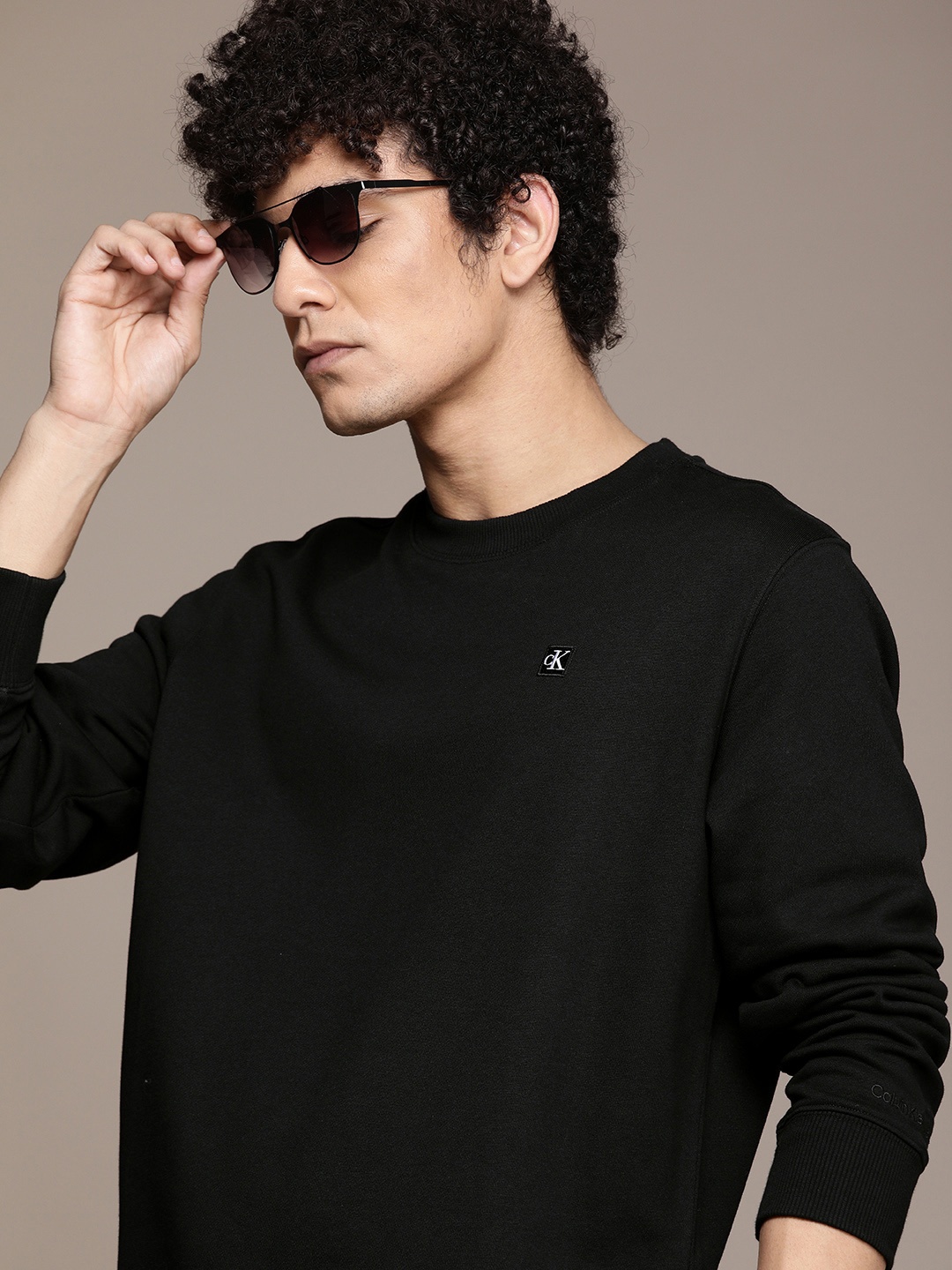 

Calvin Klein Jeans Men Black Solid Round-Neck Pullover Sweatshirt