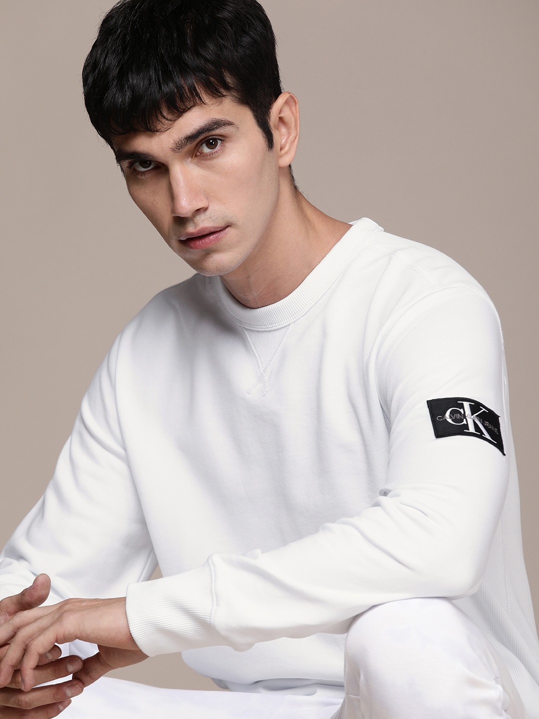 

Calvin Klein Jeans Men White Solid Pure Cotton Sweatshirt