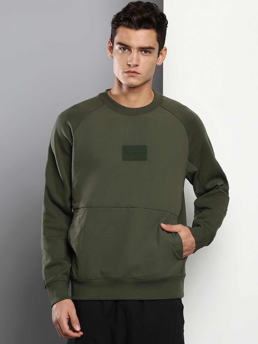 

Calvin Klein Jeans Men Olive Green Solid Sweatshirt