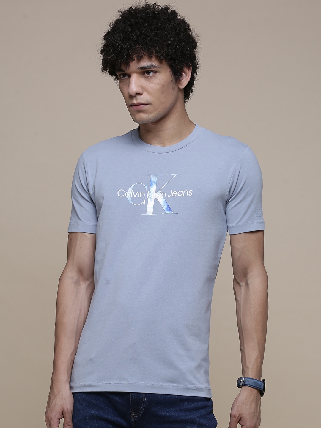 

Calvin Klein Jeans Men Blue & White Metallic Monogram Brand Logo Printed T-shirt