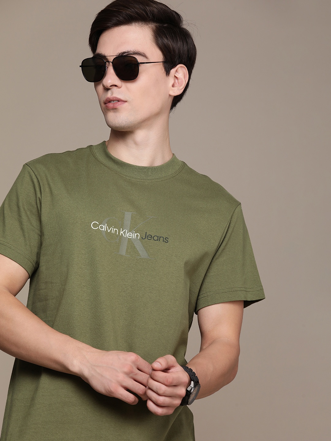 

Calvin Klein Jeans Men Olive Green Brand Logo Printed Pure Cotton Slim Fit T-shirt