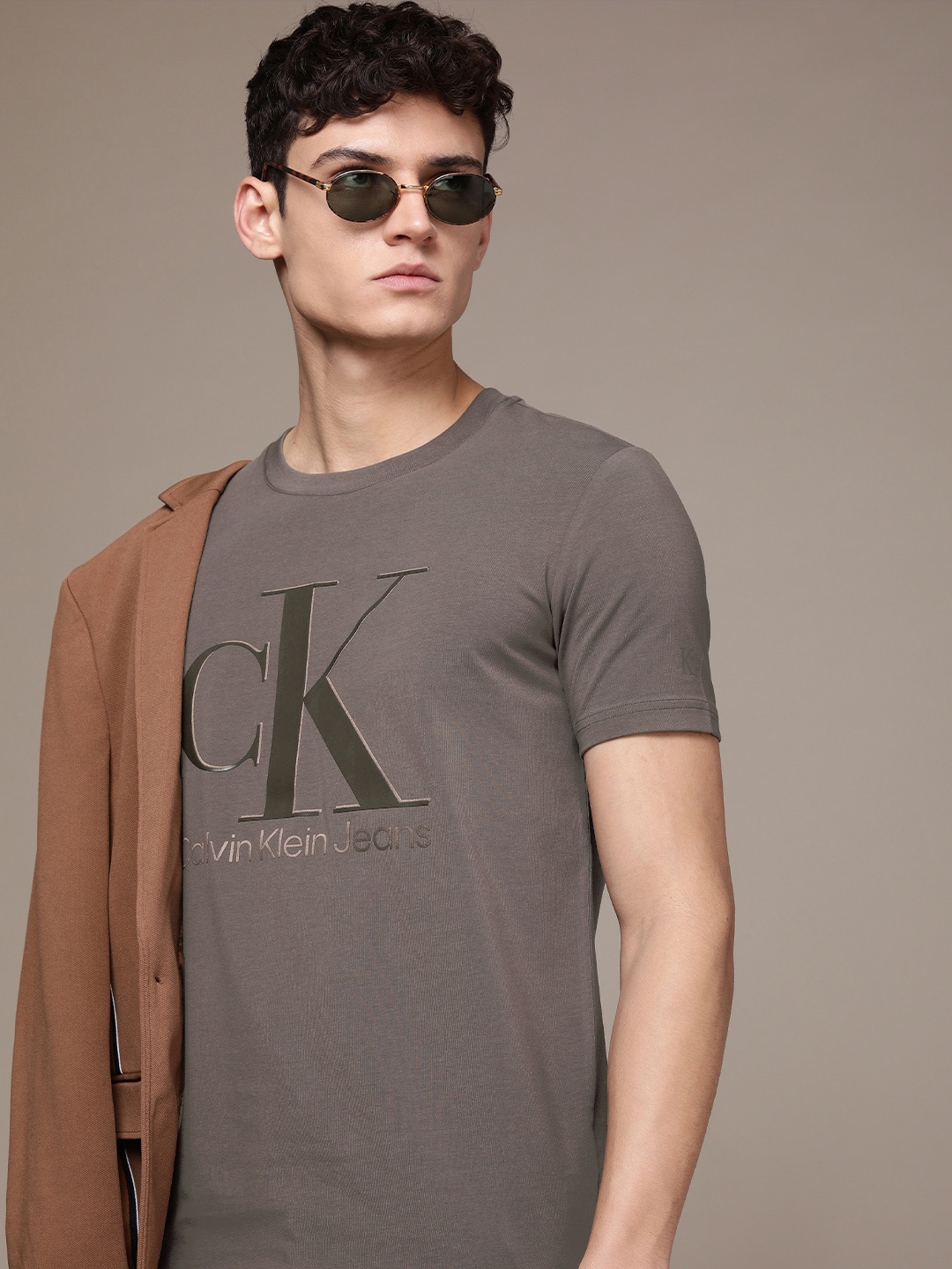 

Calvin Klein Jeans Men Mocha Brown Brand Logo Print Round Neck T-shirt