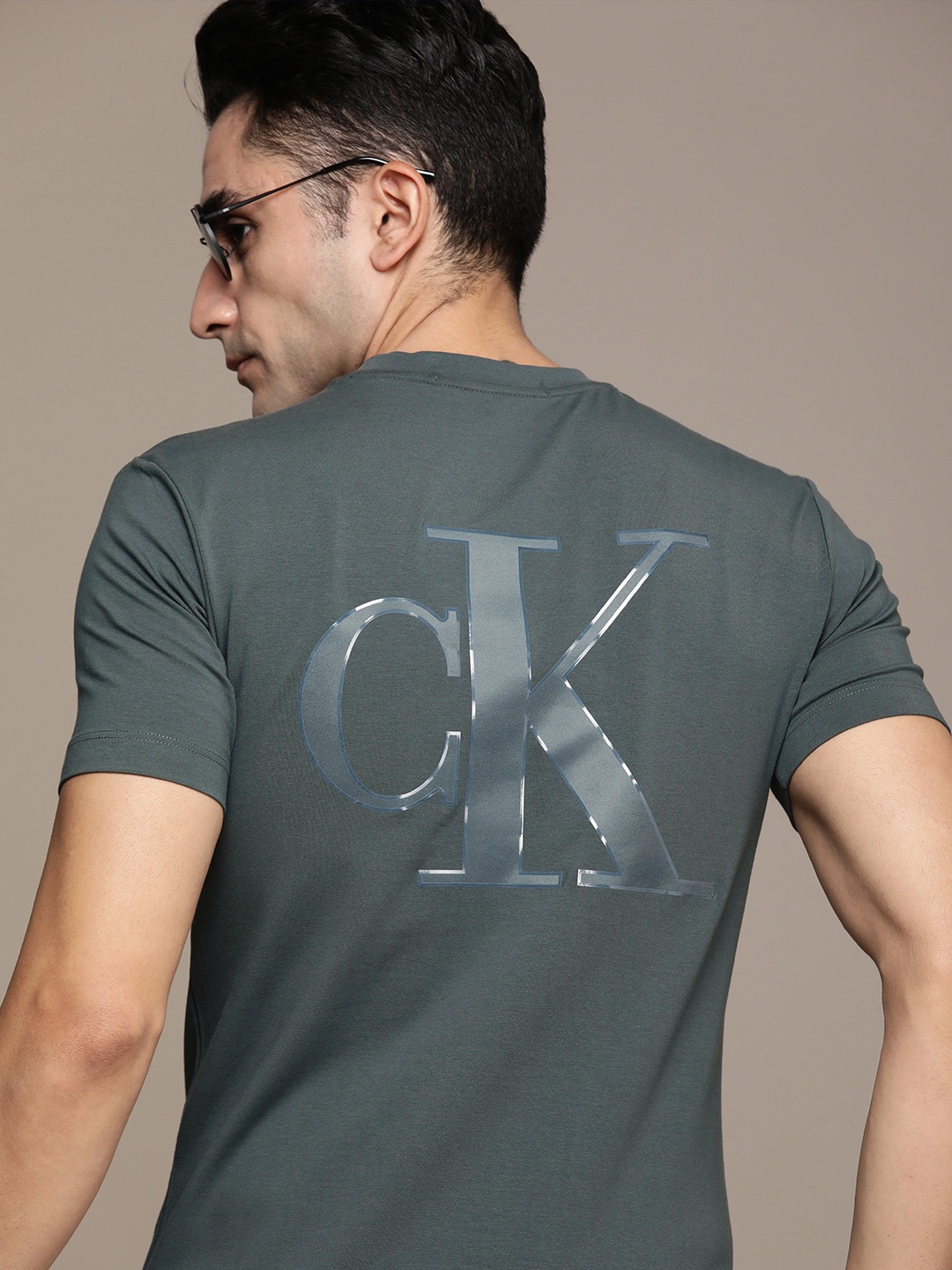 

Calvin Klein Jeans Men Teal Green Brand Logo Printed Pure Cotton Applique T-shirt