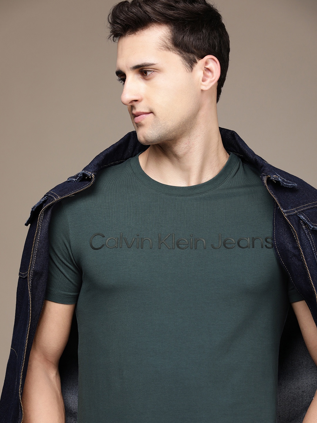 

Calvin Klein Jeans Men Teal Green Typography Printed T-shirt