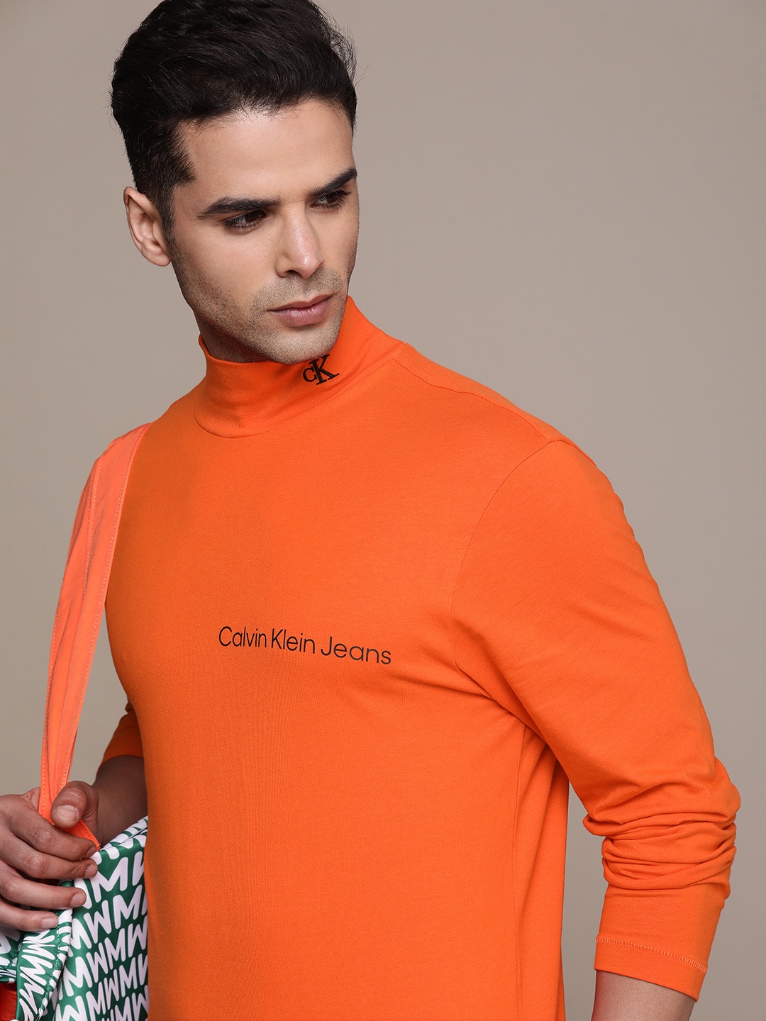 

Calvin Klein Jeans Men Orange Brand Logo Printed High Neck Pure Cotton T-shirt