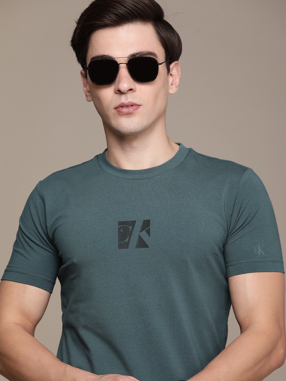 

Calvin Klein Jeans Men Teal Blue & Black Brand Logo Printed Slim Fit T-shirt