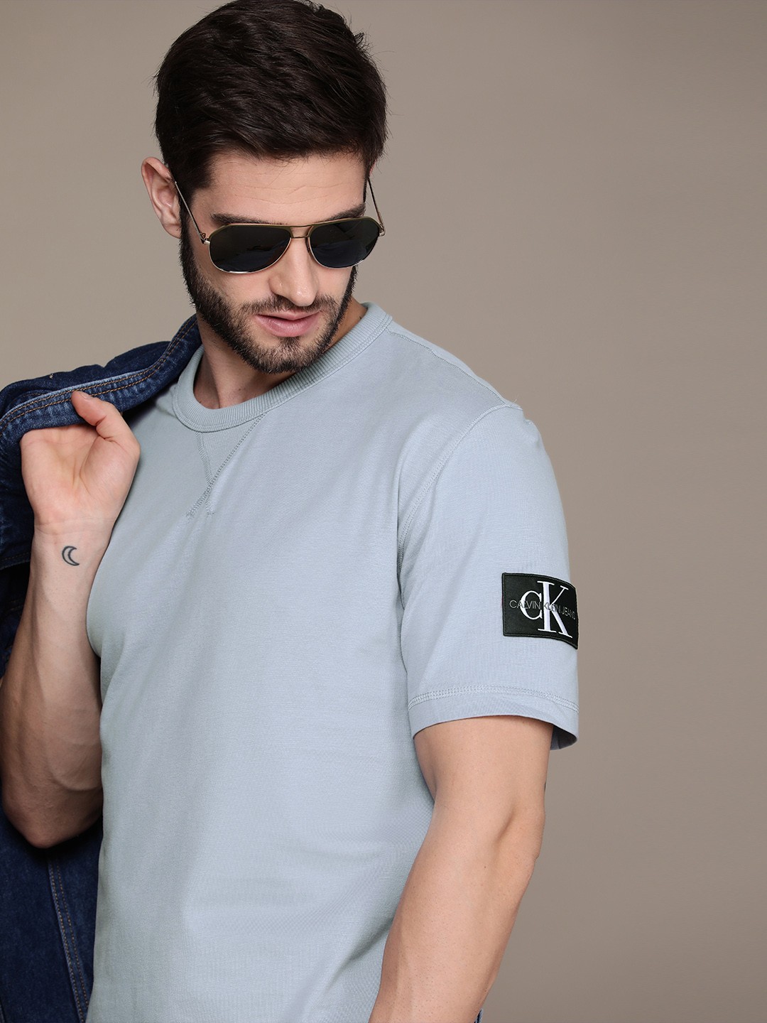 

Calvin Klein Jeans Men Grey Solid Pure Cotton Casual T-shirt