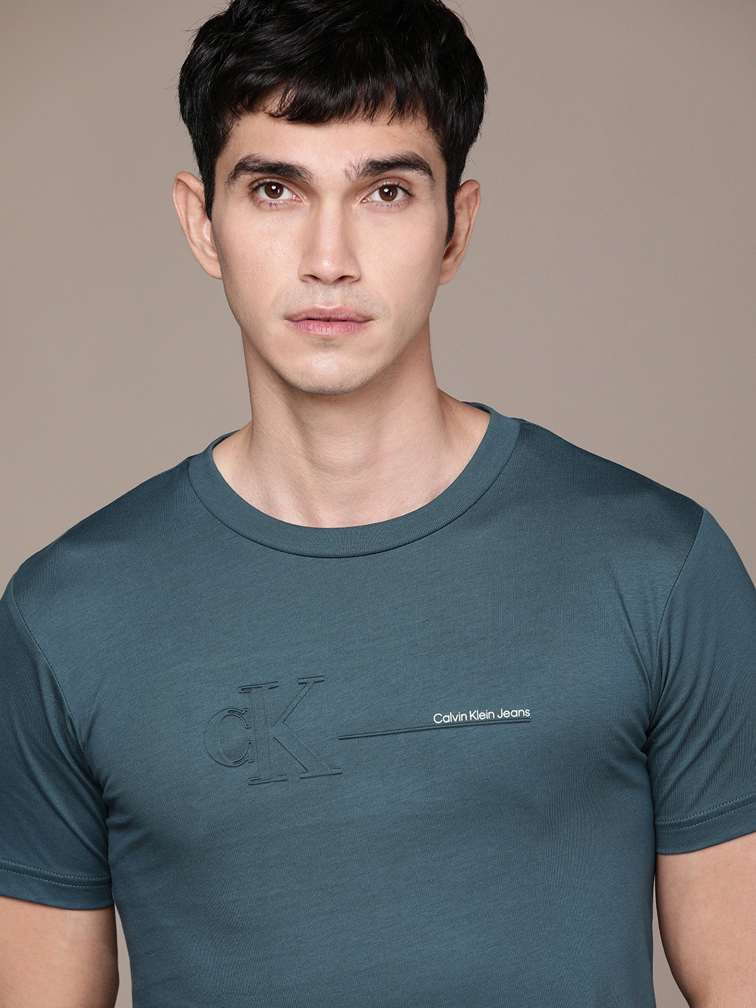 

Calvin Klein Jeans Men Teal Green Brand Logo Printed Pure Cotton Applique T-shirt
