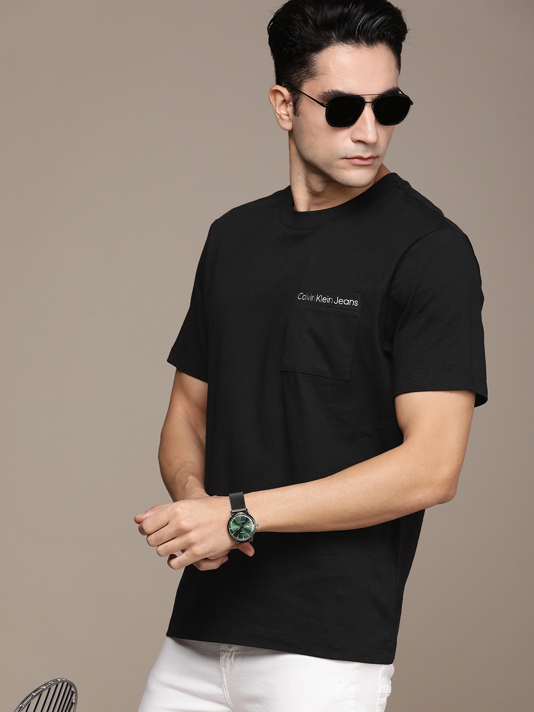 

Calvin Klein Jeans Men Black Solid Pure Cotton Slim Fit T-shirt