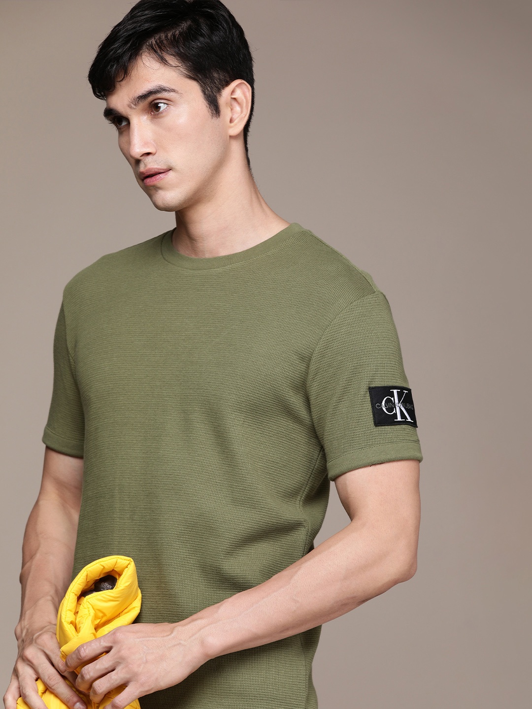 

Calvin Klein Jeans Men Olive Green Self Design Drop-Shoulder Sleeves Pure Cotton T-shirt