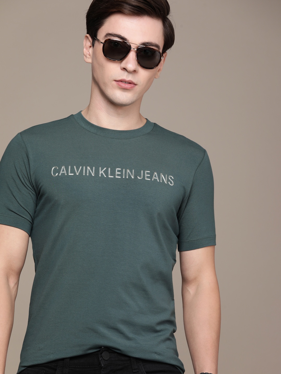 

Calvin Klein Jeans Men Teal Green Pure Cotton Applique Slim Fit T-shirt