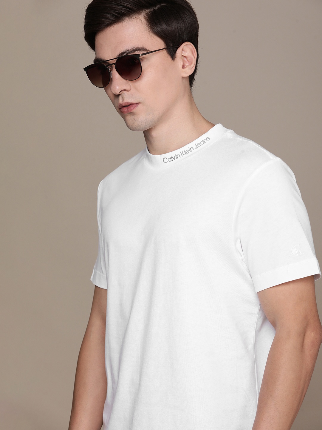 

Calvin Klein Jeans Men White Solid Pure Cotton Casual T-shirt