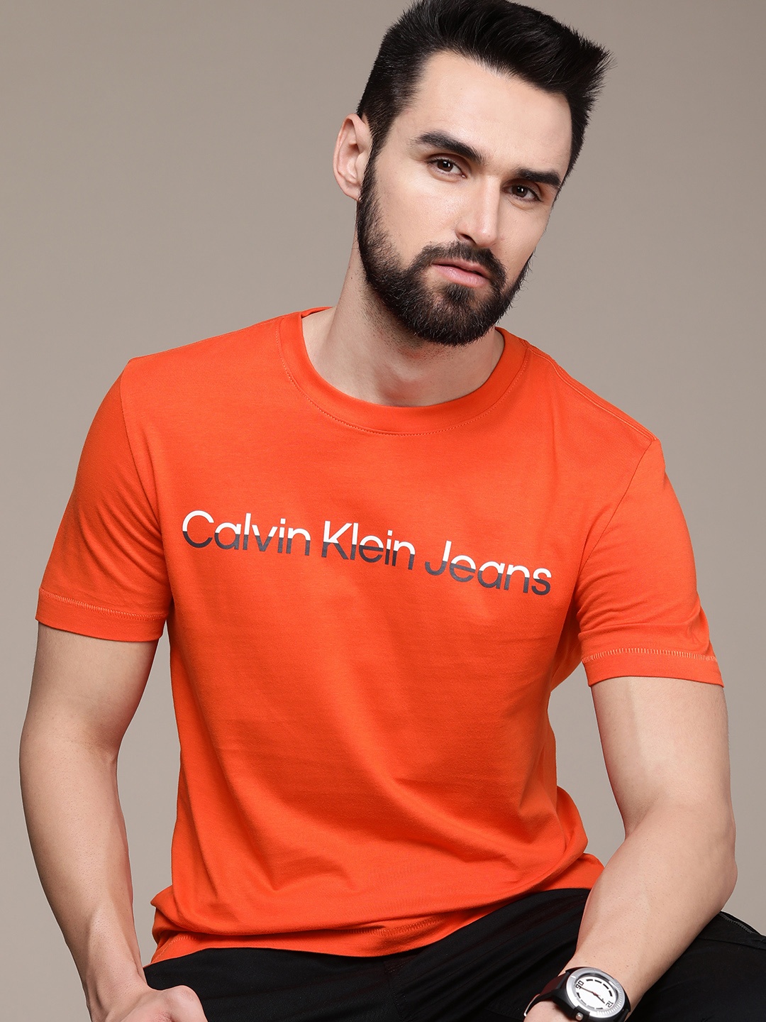 

Calvin Klein Jeans Men Orange Brand Logo Printed Pure Cotton T-shirt