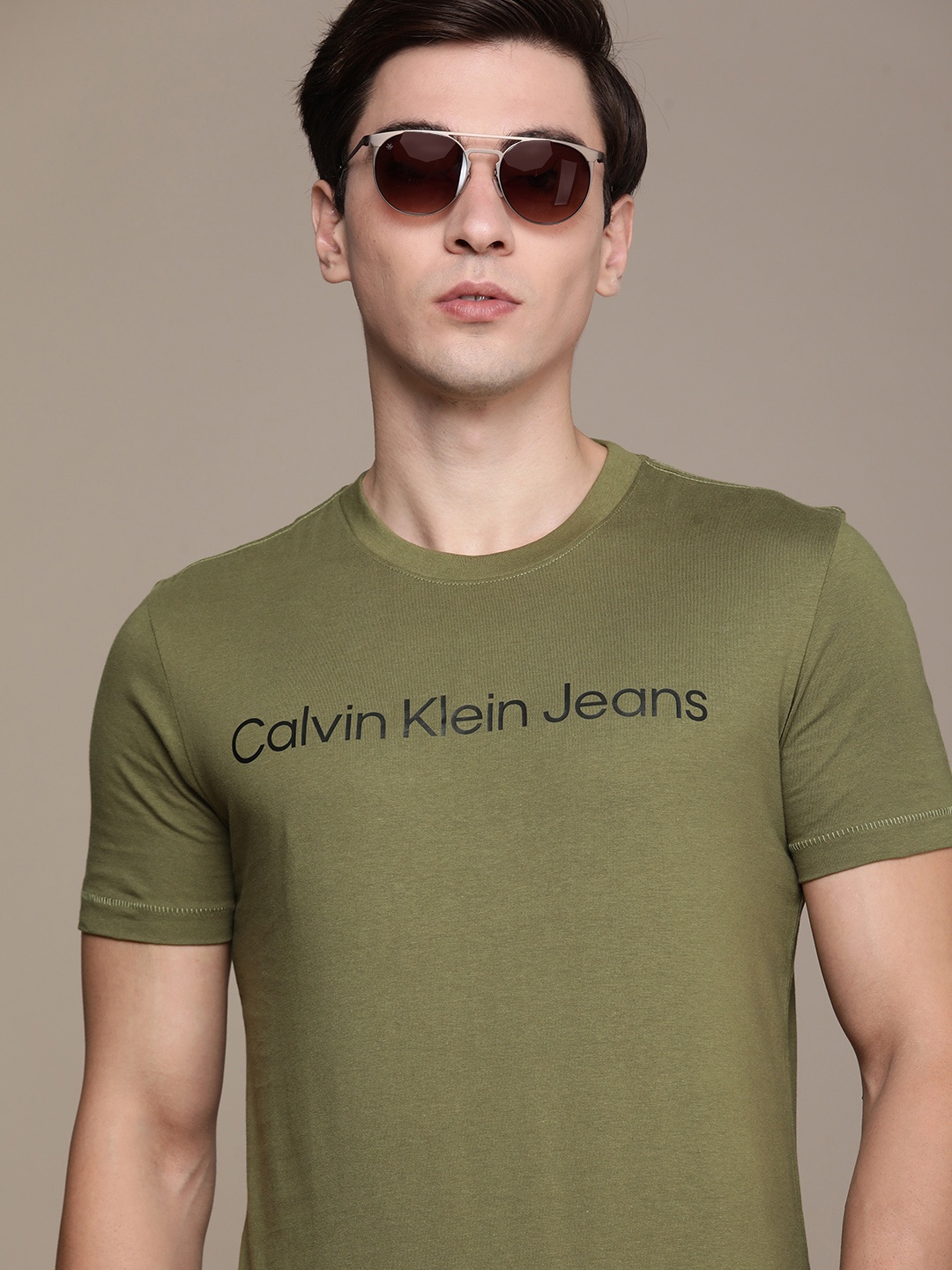 

Calvin Klein Jeans Men Olive Green Brand Logo Printed Pure Cotton Slim Fit T-shirt