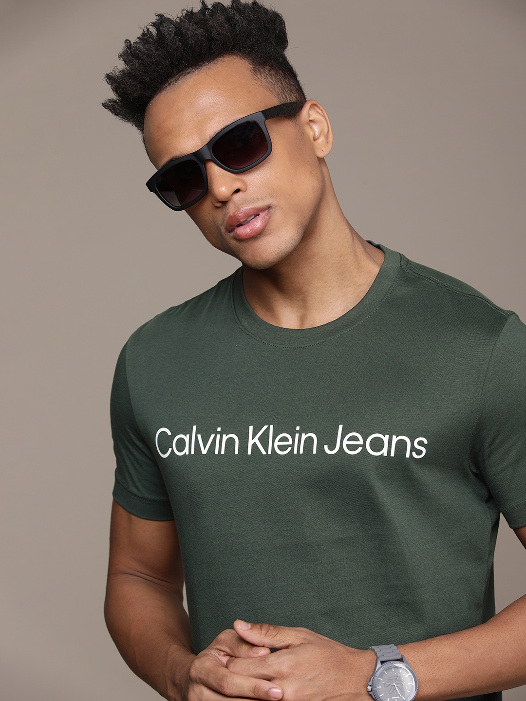 

Calvin Klein Jeans Men Teal Green & White Typography Printed Pure Cotton T-shirt