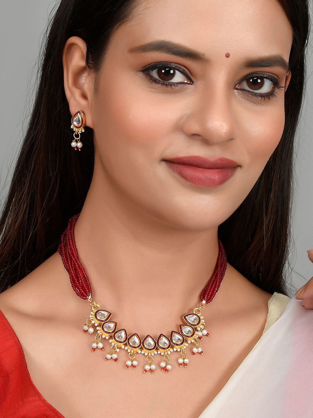 

Silvermerc Designs Gold-Plated Red & White Stone Studded & Red Beaded Jewellery Set