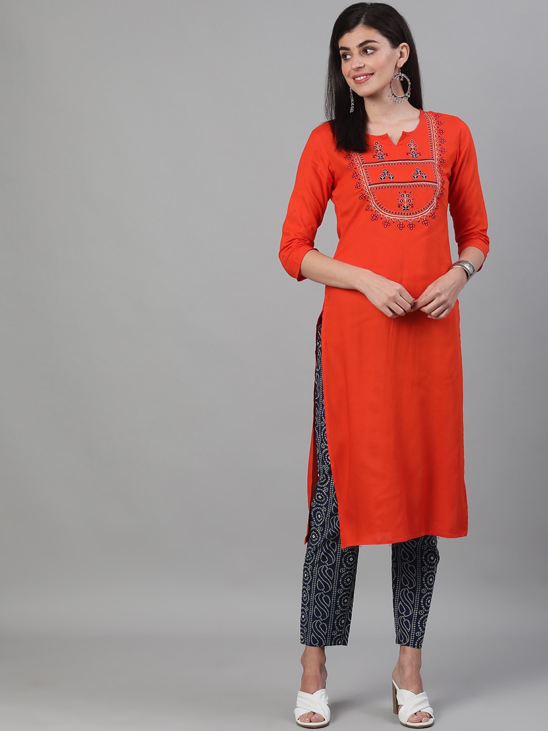 

KIMAYRA Women Orange Yoke Design Panelled Kurta with Trousers