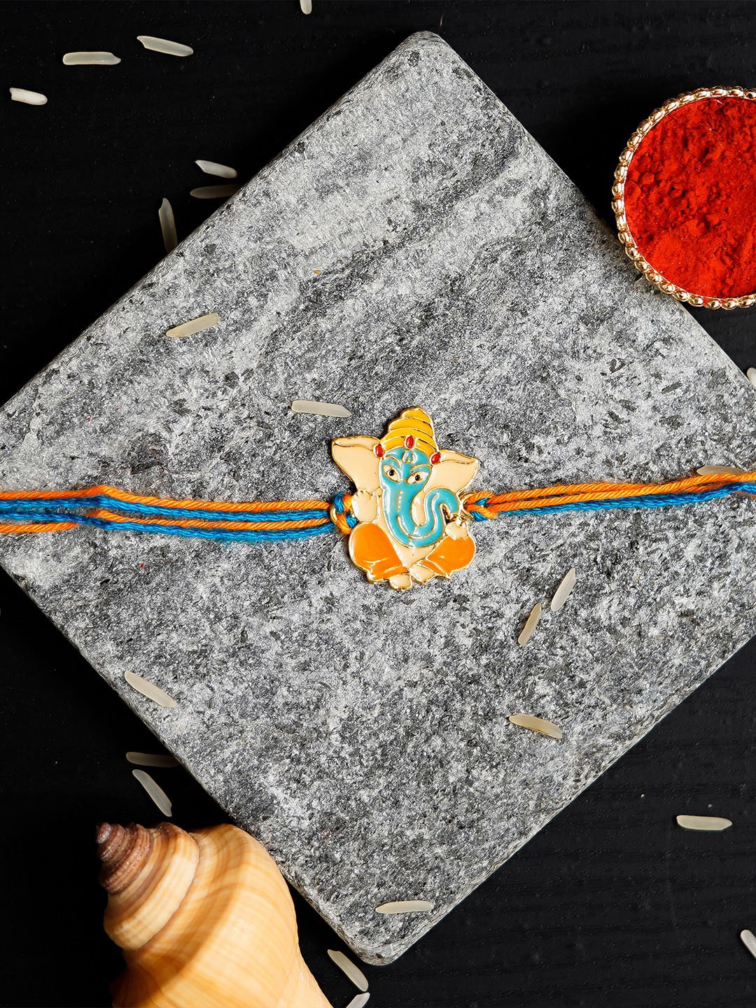 

eCraftIndia Orange Ganesha Design Rakhi & Roli Chawal Pack