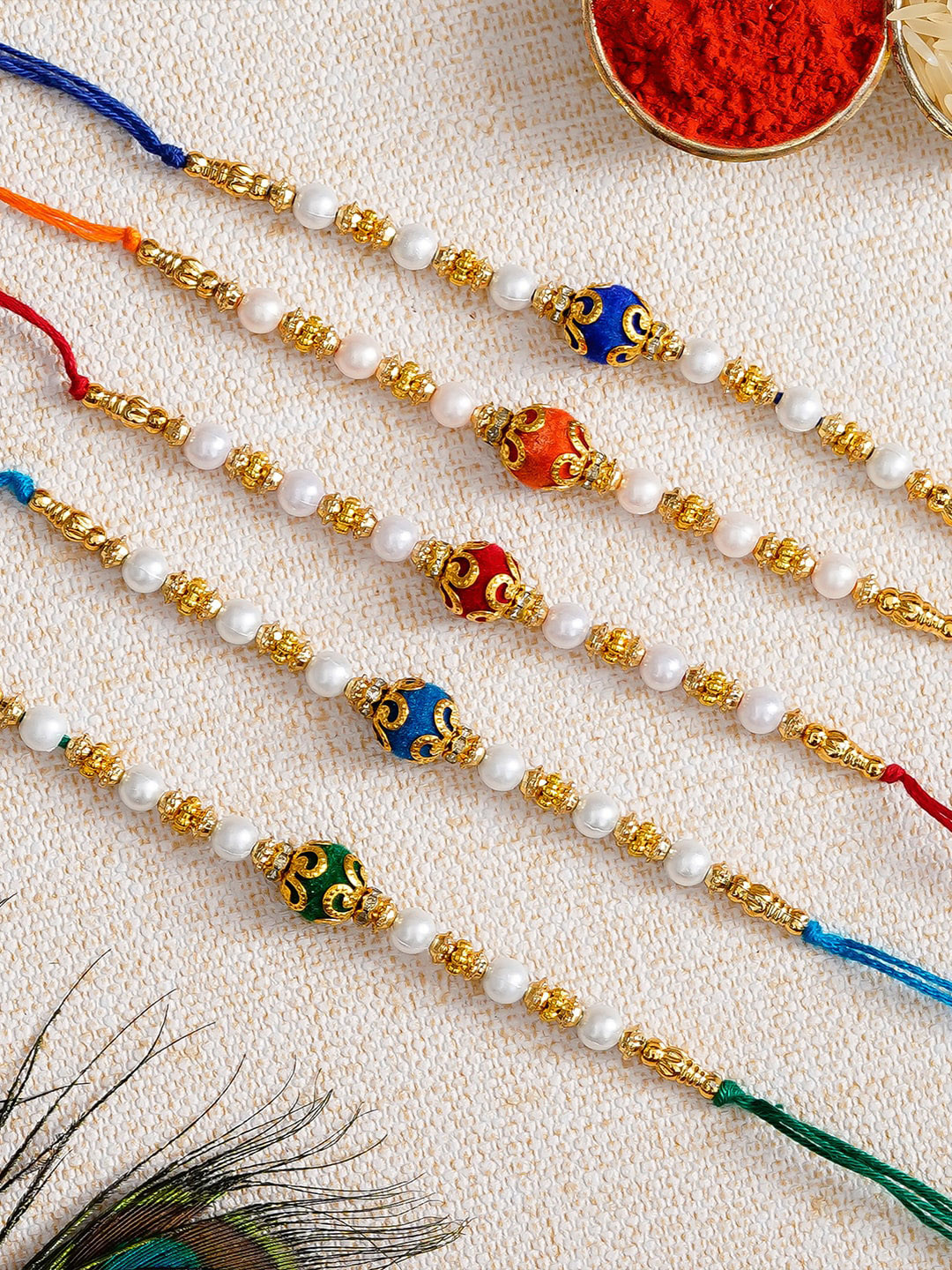 

eCraftIndia Pack of 5 Rakhis and Roli Chawal Pack, Multi