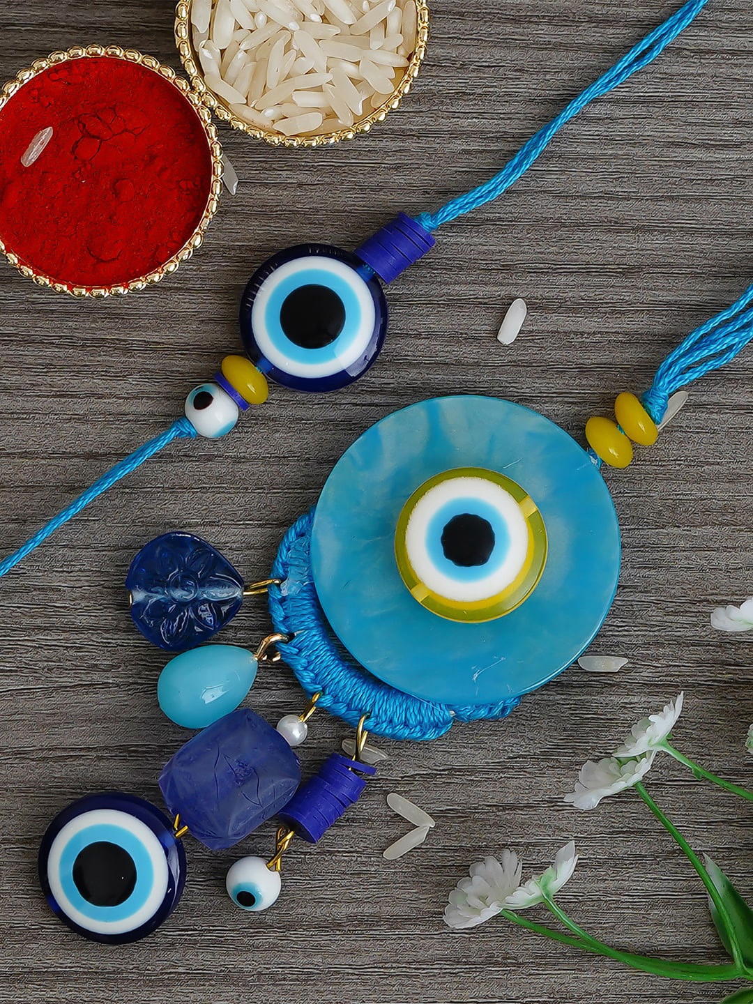 

eCraftIndia Set of 2 Blue Evil Eye Bhaiya Bhabhi Rakhi with Roli Chawal