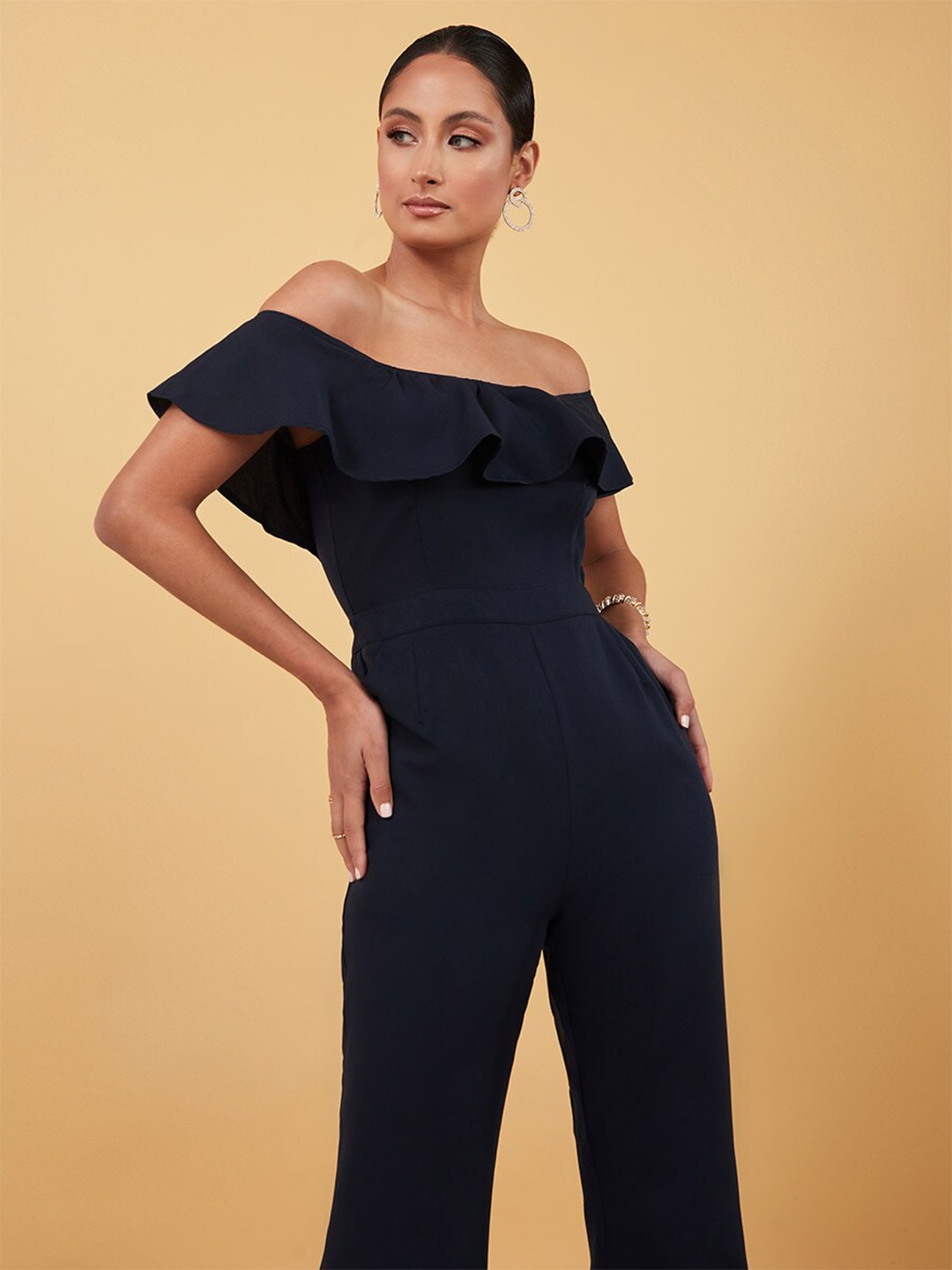 

Styli Navy Blue Off Shoulder Wide Leg Jumpsuit with Ruffle Detail