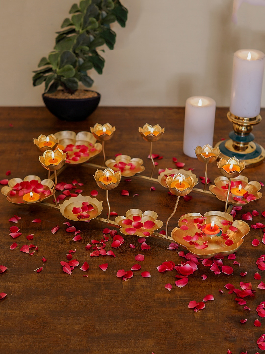 

StatueStudio Gold-Toned Metal Tealight Candle Holder With Urli Bowls