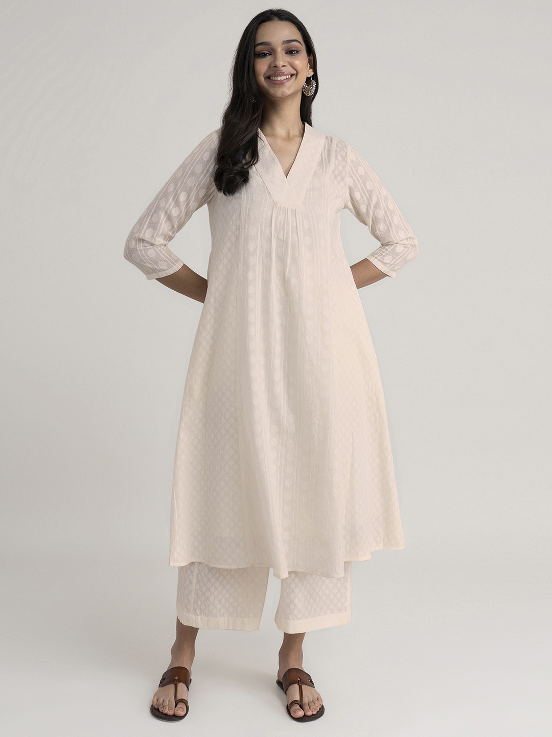 

Pink Fort Women Off White Pure Cotton Kurti with Palazzos