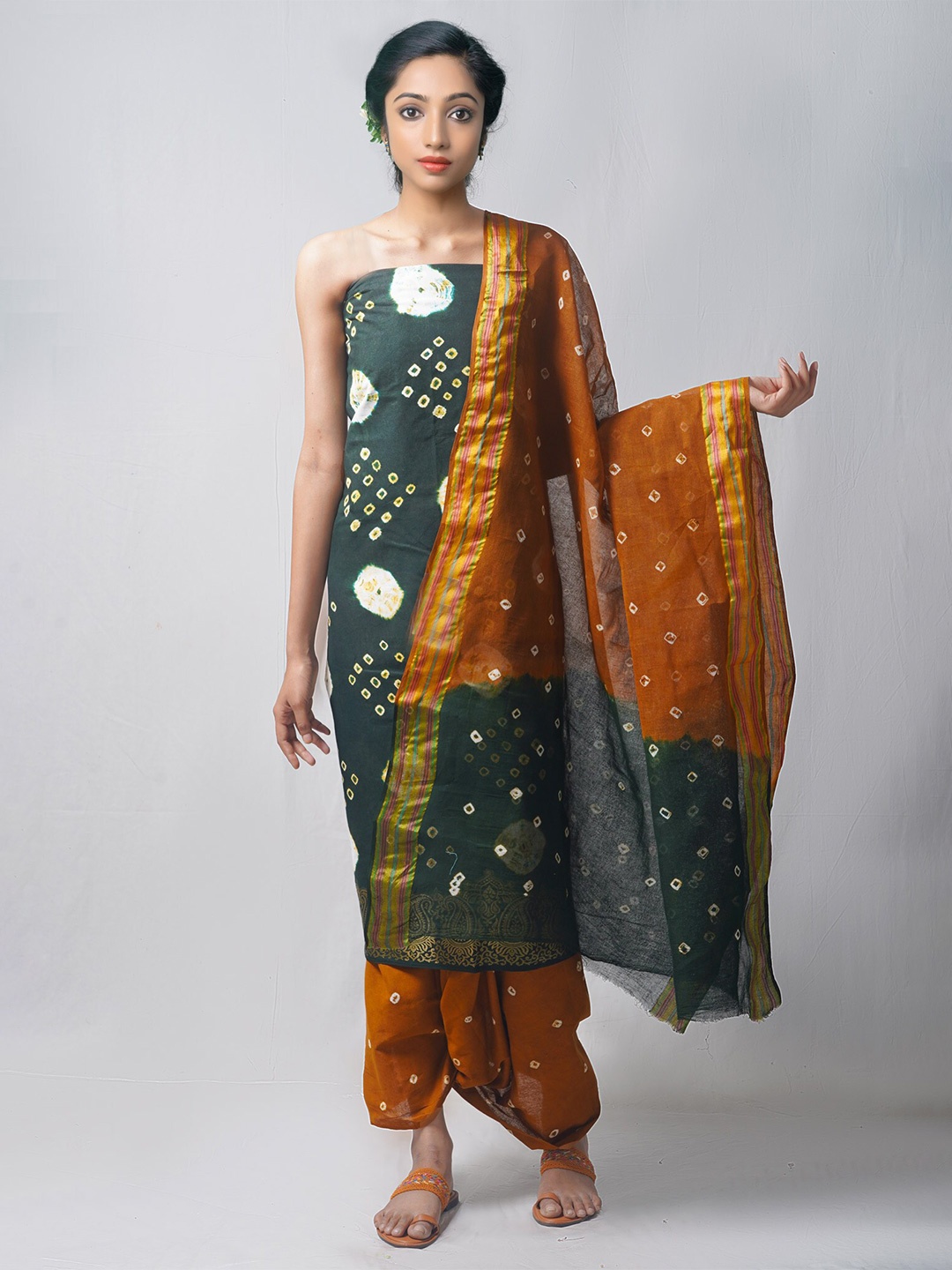 

Unnati Silks Green & Orange Dyed Pure Cotton Unstitched Dress Material