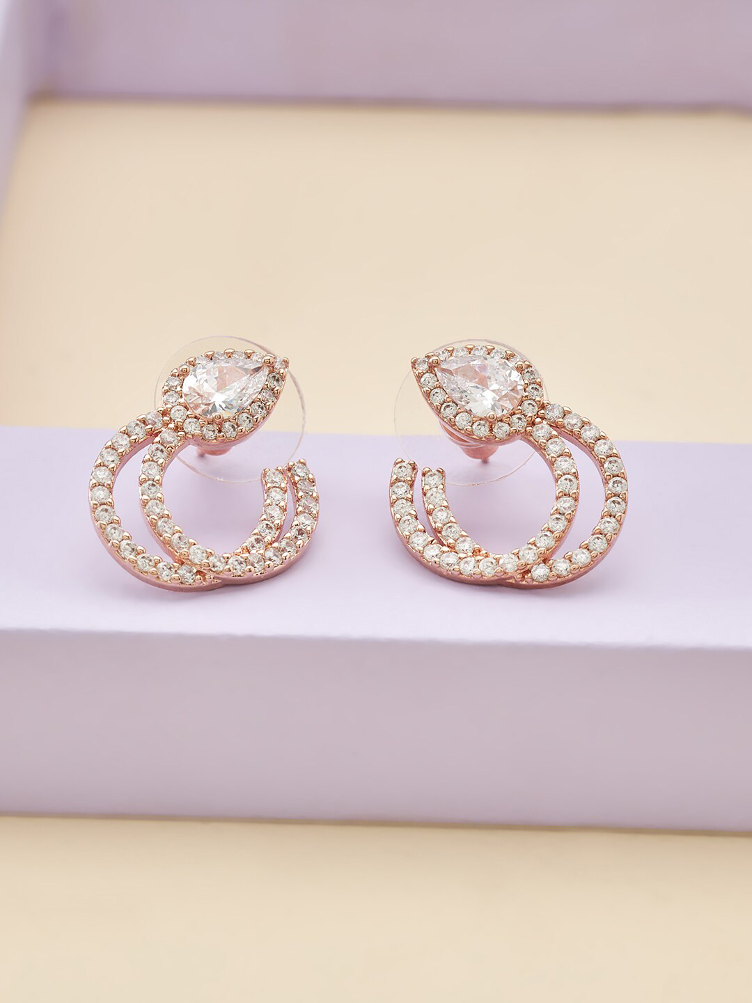 

Kushal's Fashion Jewellery White Teardrop Shaped Studs Earrings