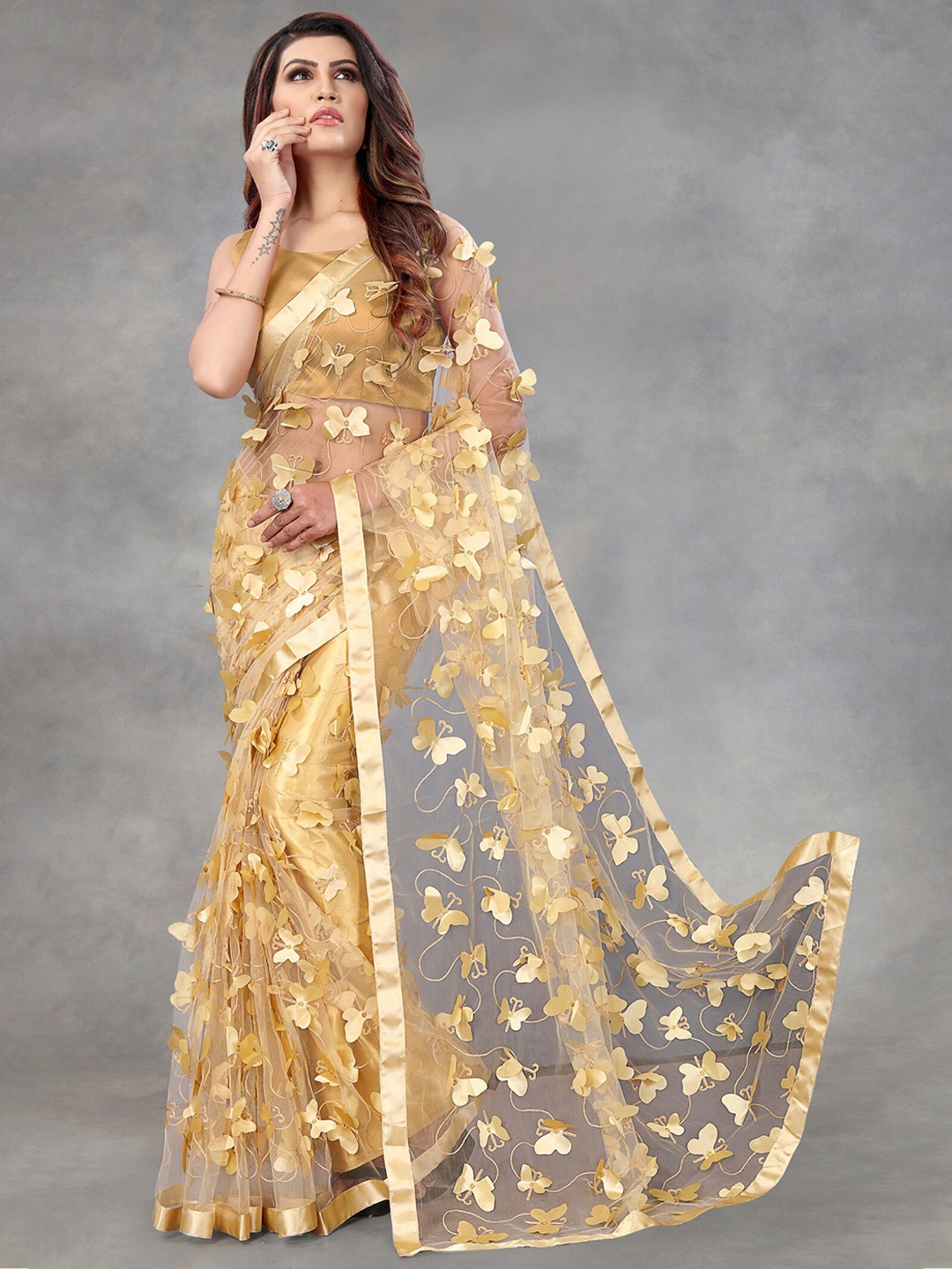 

APNISHA Beige Embellished Embroidered Net Saree