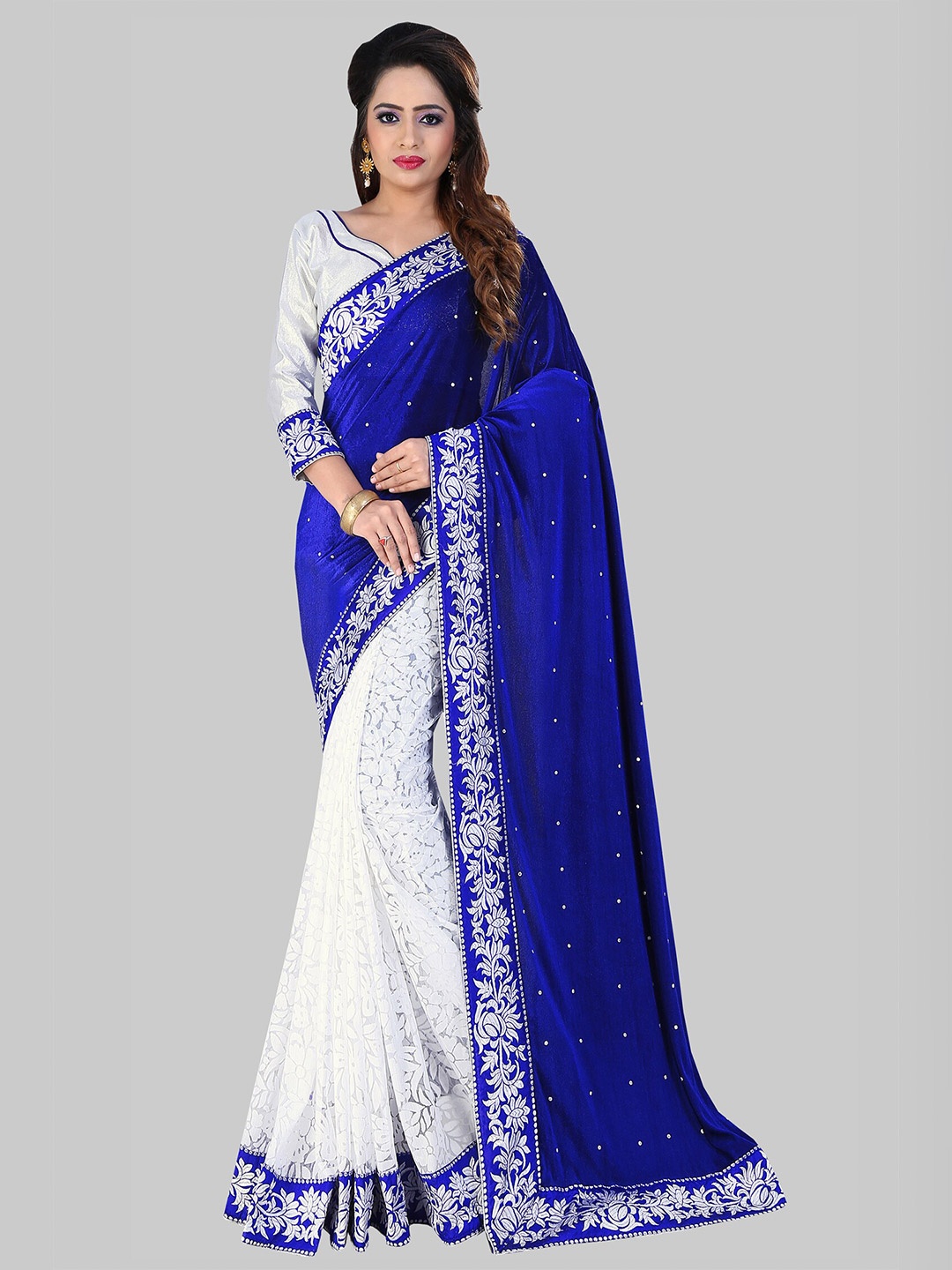 

APNISHA Blue & White Embellished Embroidered Velvet Saree