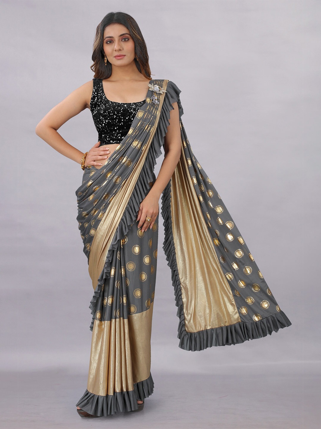 

APNISHA Grey & Gold-Toned Ethnic Motifs Saree