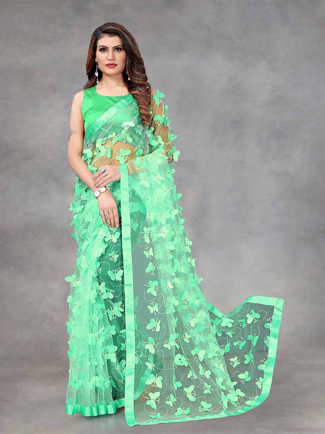 

APNISHA Green Ethnic Motifs Embroidered Net Saree
